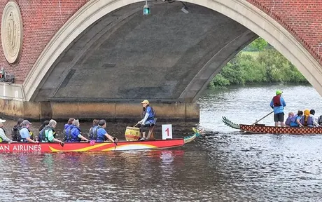 Dragon boat teams racing on the Charles River